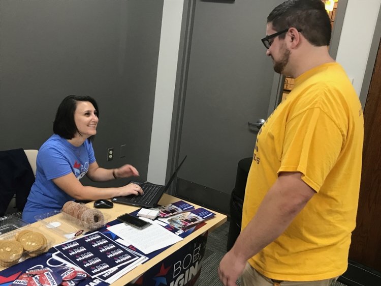 Student getting information at Campaign Volunteer Fair