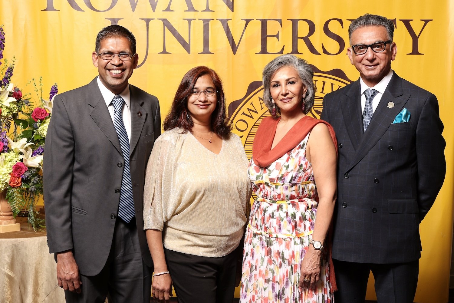 A photo of President Houshmand and three others at a reception.