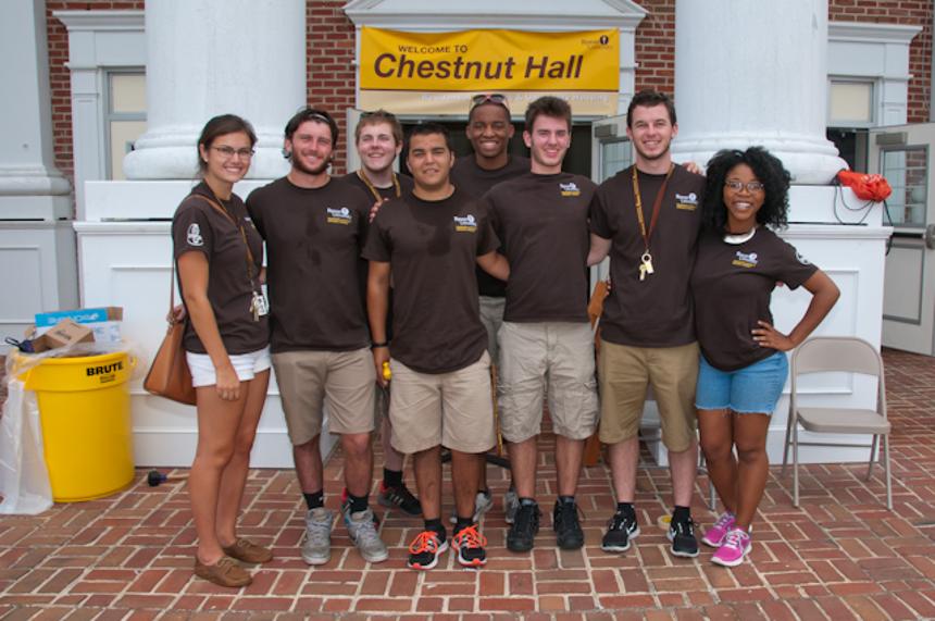A group of students stand outside Chestnut Hall.