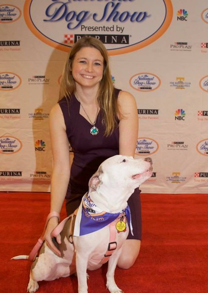 Michele Pich, Assistant Director, and her dog Vivian on the red carpet.