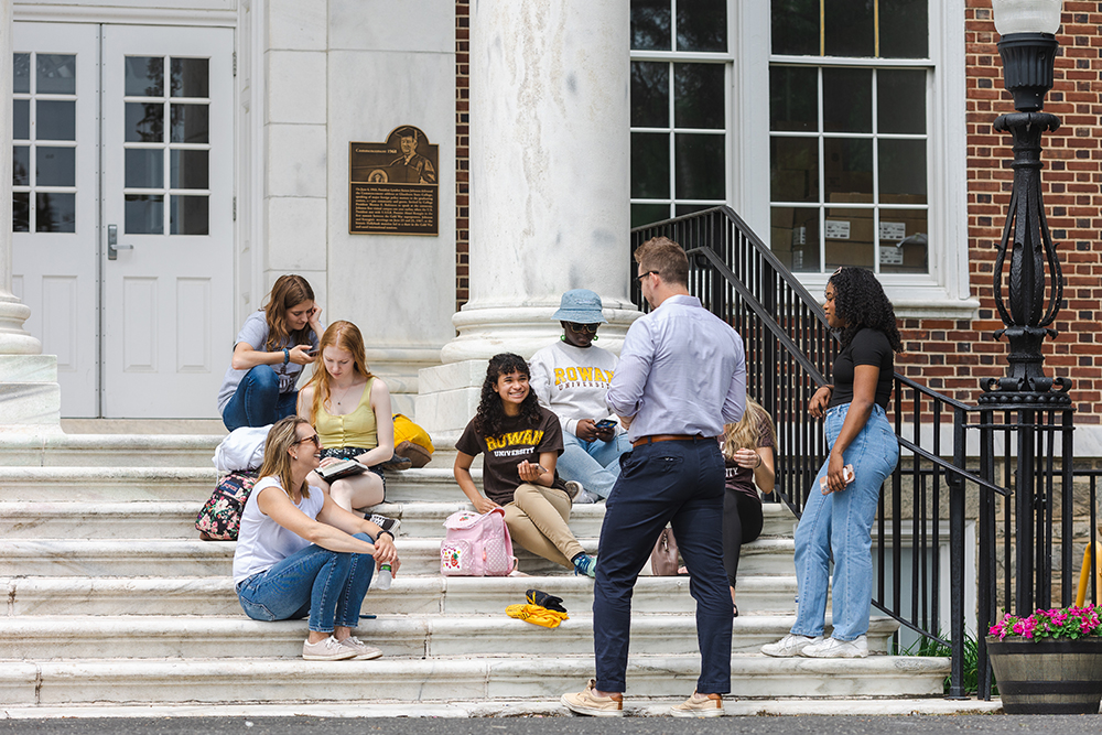 group of students sitting on Bunce Hall steps