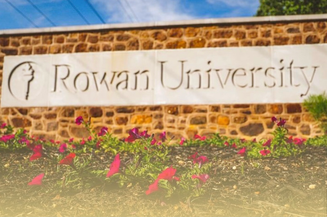 A photo of a stone border that has Rowan University engraved.