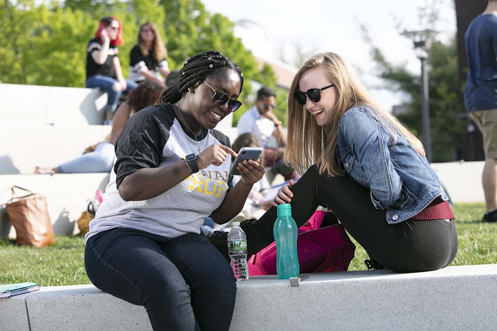 A photo of a student talking on the phone.