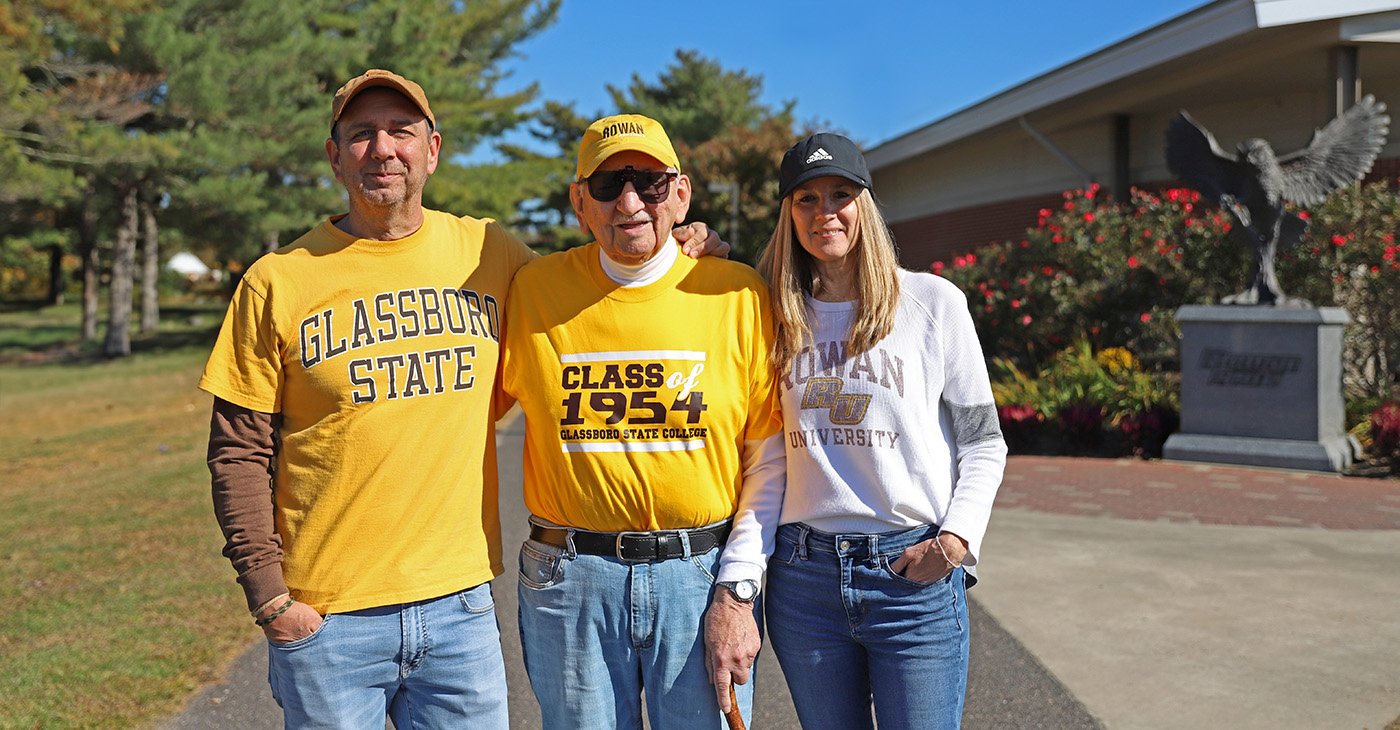 A photo of three Rowan Alumni returning to campus.