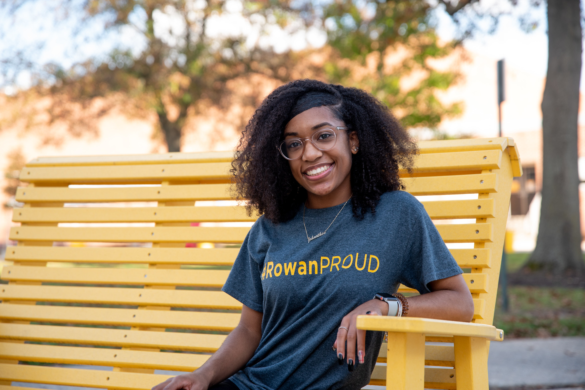 A Rowan Student Wearing a Rowan Proud Shirt.