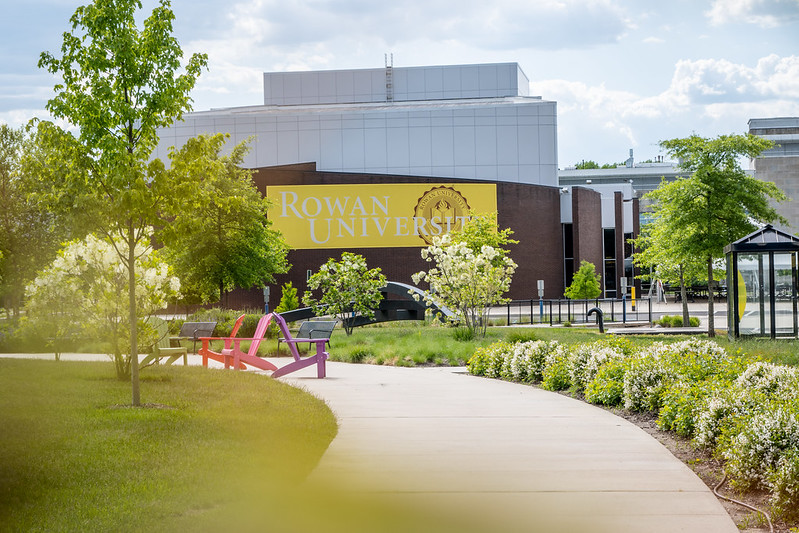 A photo of Wilson Hall with a Rowan University banner.