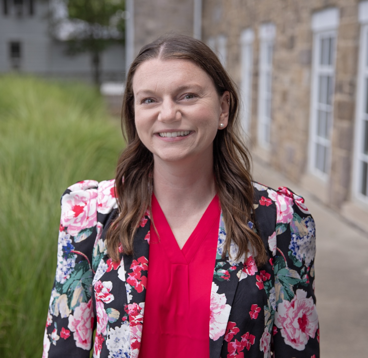 A portrait of Colleen smiling.