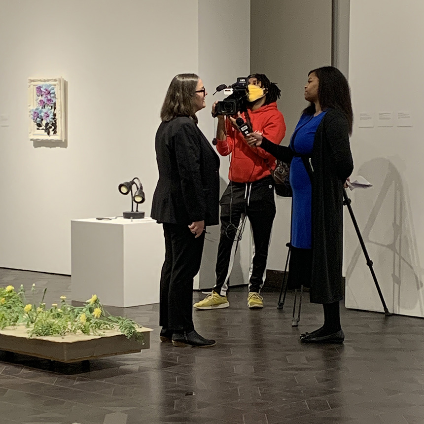 Director and Chief Curator Mary Salvante being interviewed in the gallery.