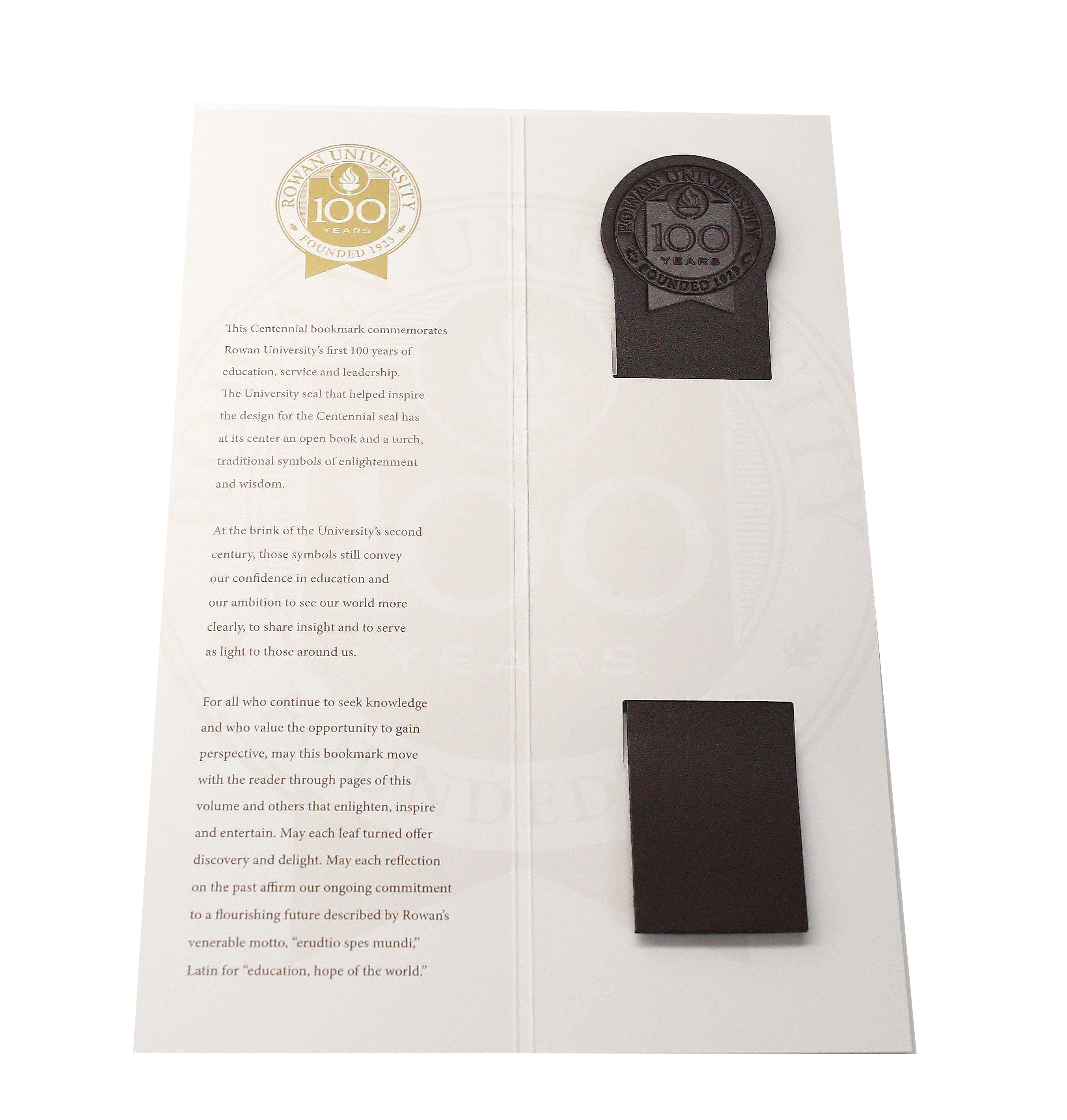 Chocolate brown Centennial leather bookmark in Centennial history cardstock packaging.