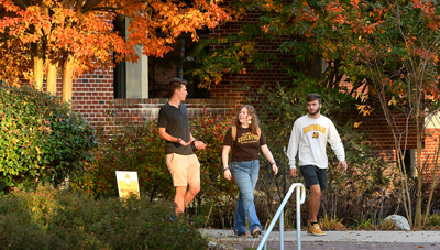 students walking outside fall