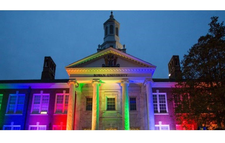 Image of Bunce Hall in rainbow colored lights