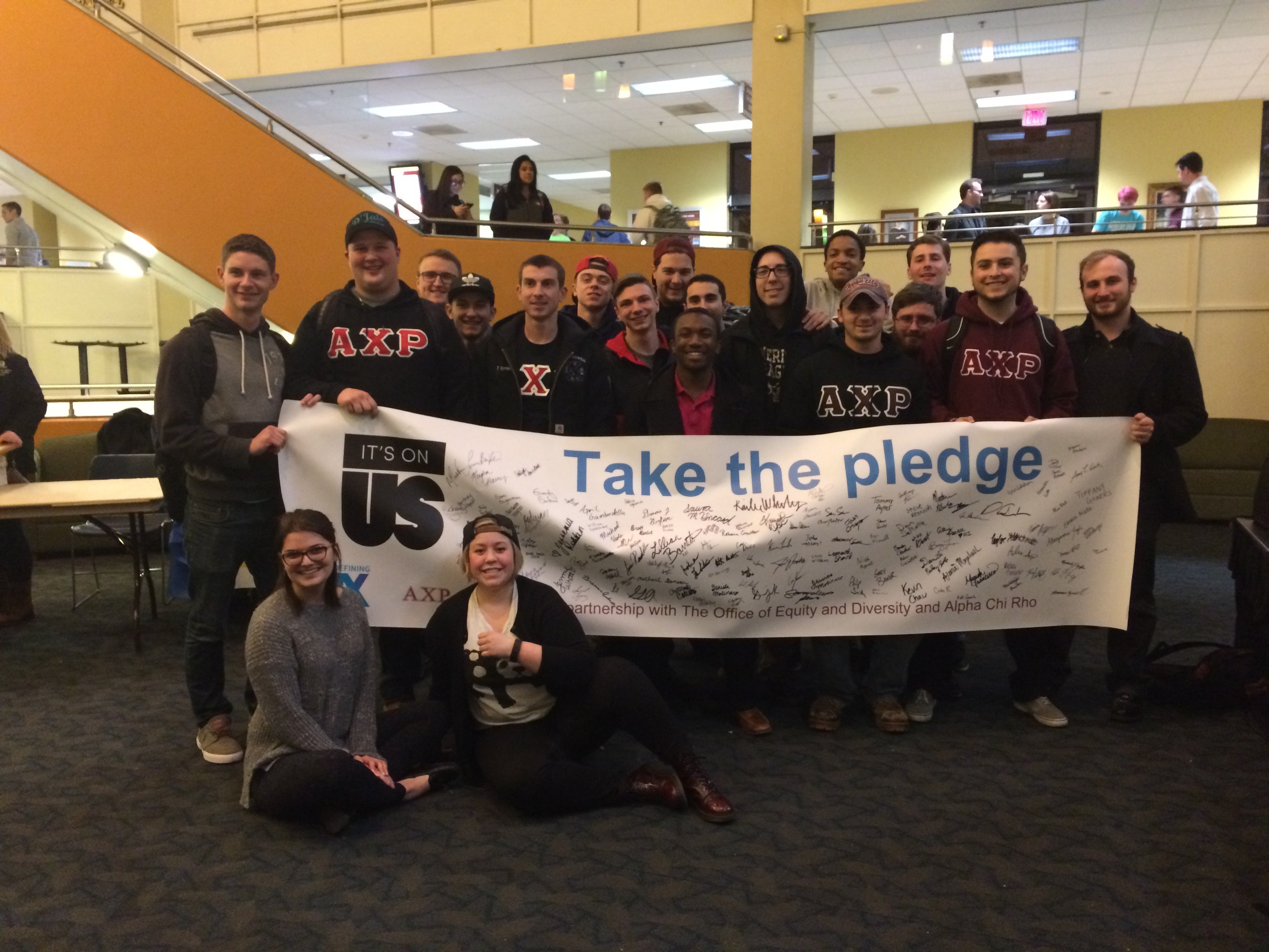 Its On Us Pledge Students with Banner