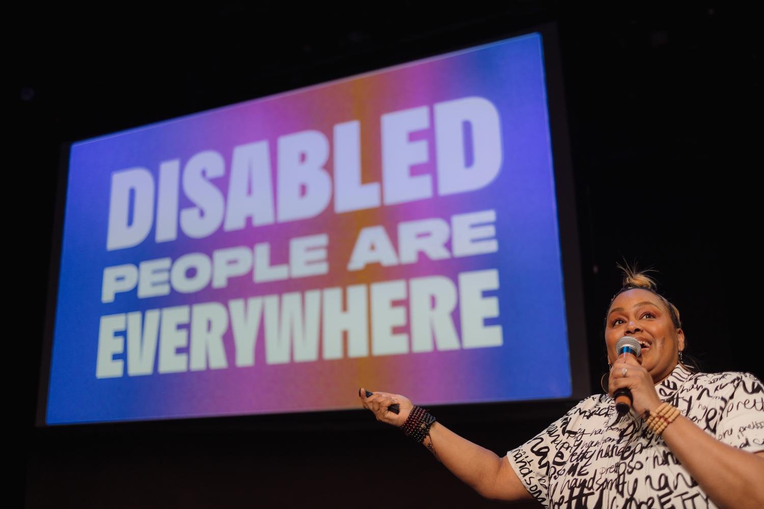 Jen White–Johnson with "Disabled People Are Everywhere" Art