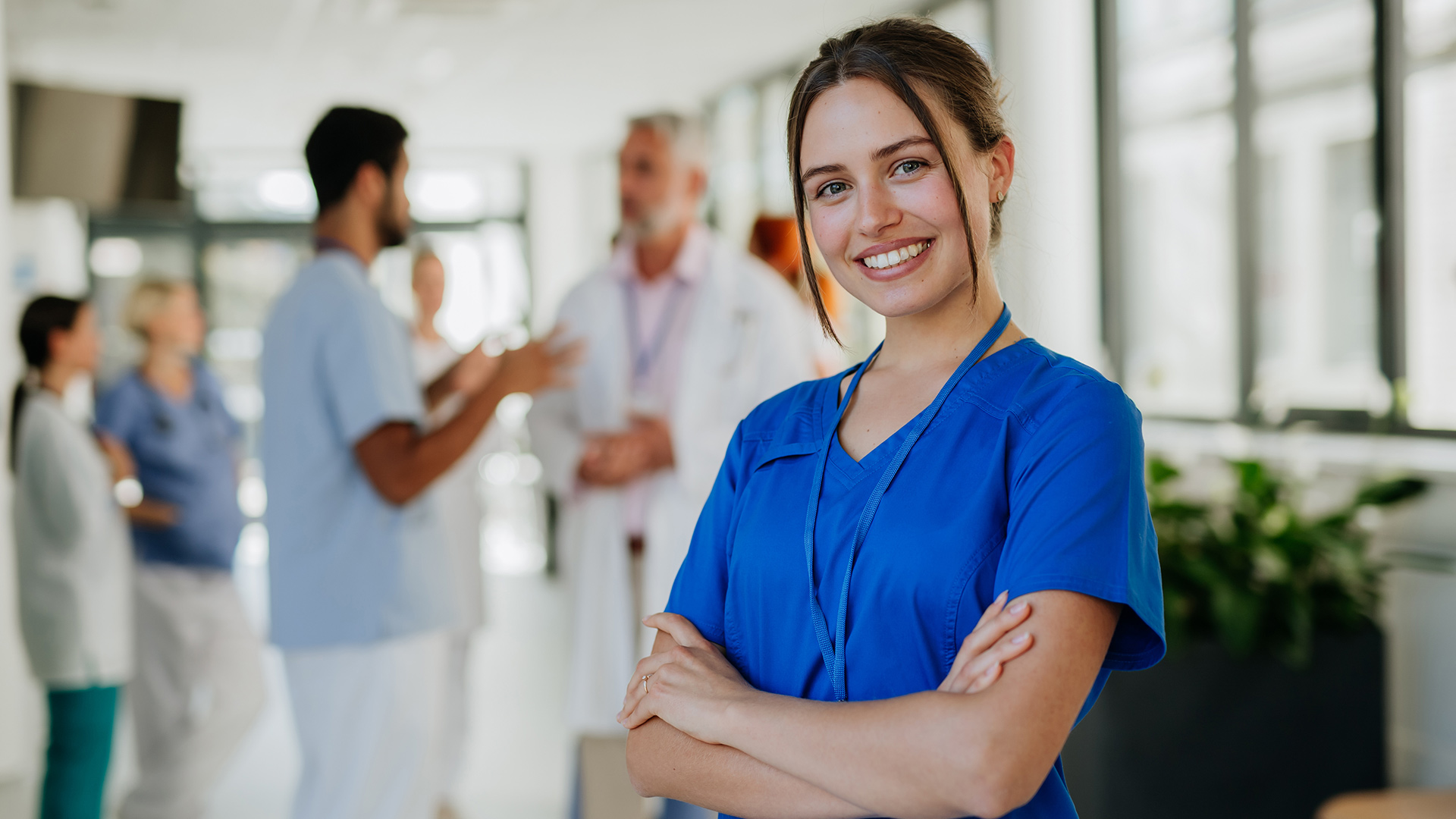 smiling nurse with laptop