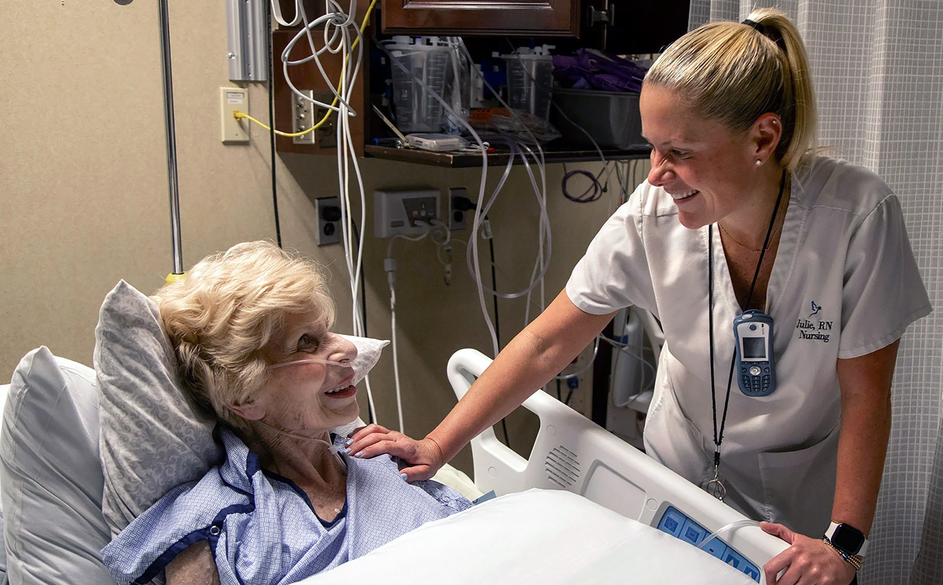 smiling nurse tending to a patient