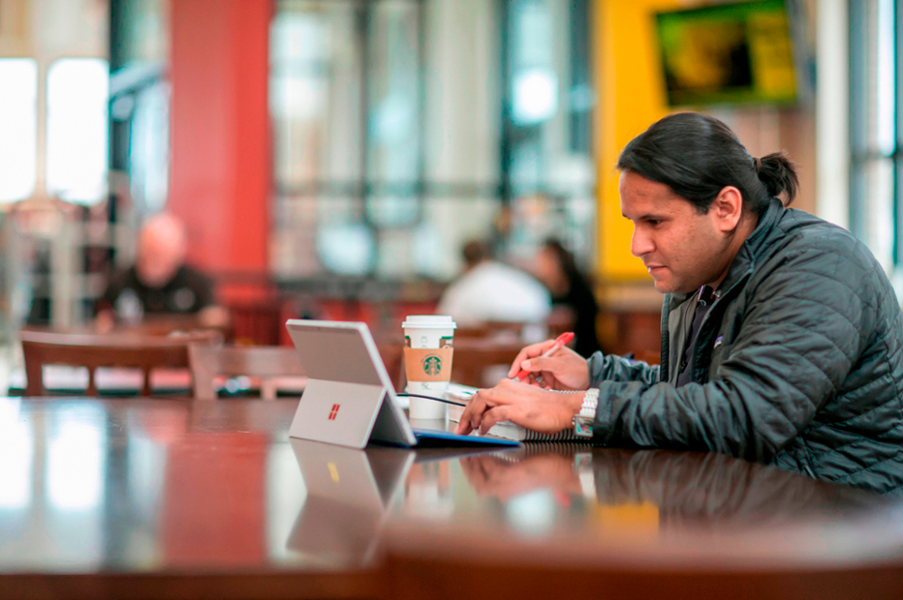 student working at laptop