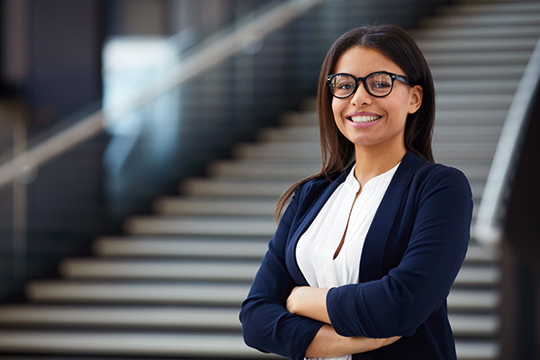 business person with glasses smiling