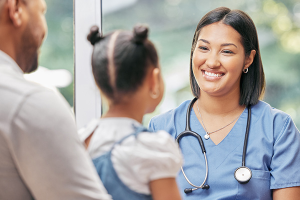 pediatric nurse smiling at child