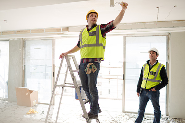 two construction managers inspecting construction site