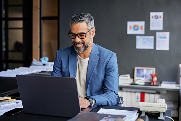 man working from a laptop
