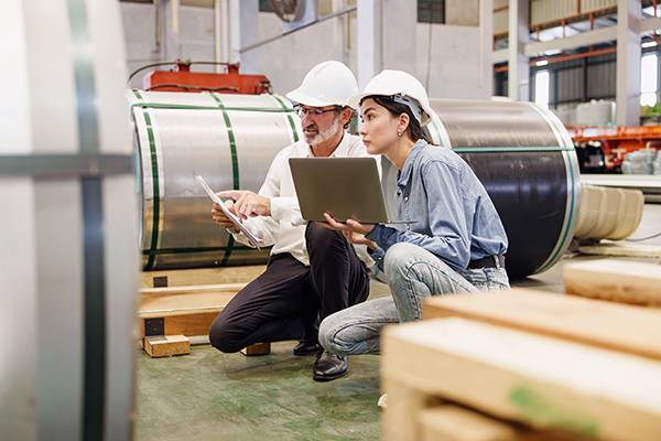 two construction managers doing sheet metal inventory
