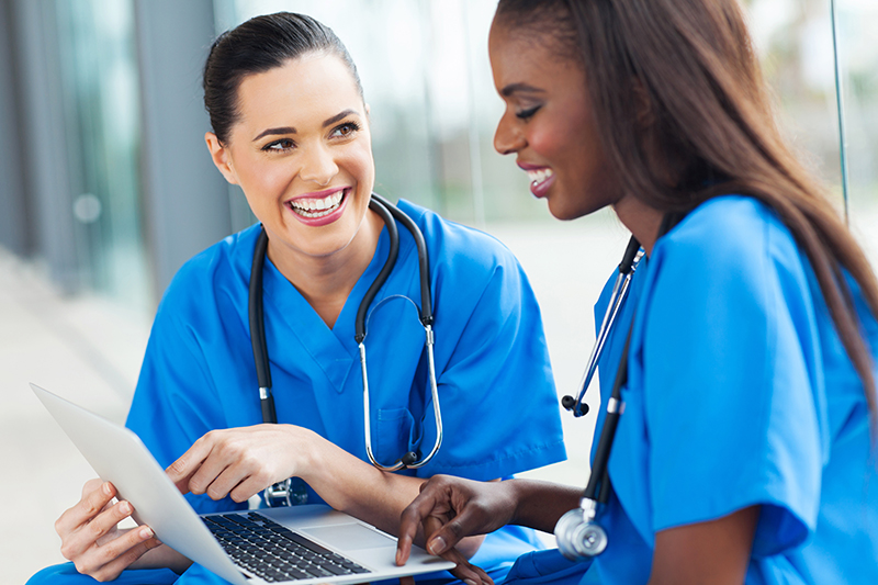 nurses working on laptop