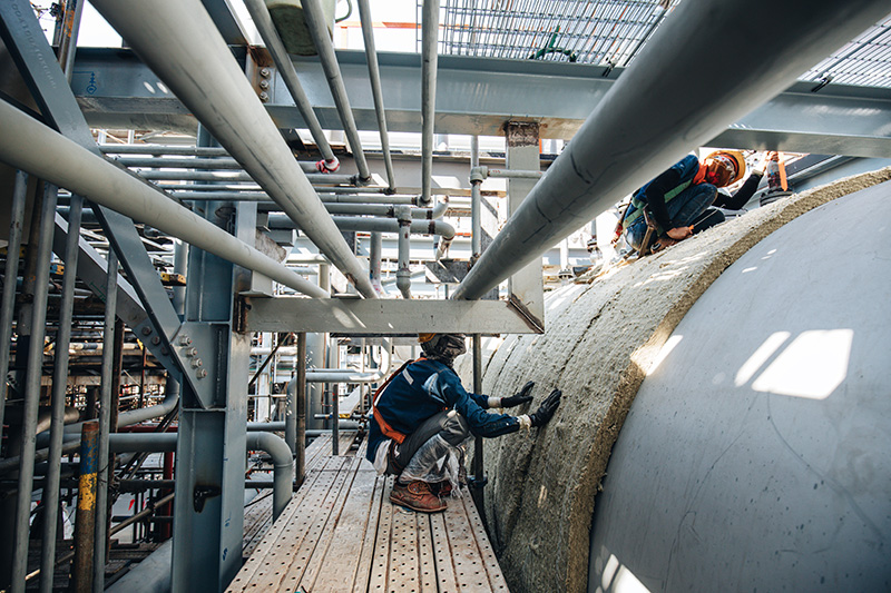insulation workers inspecting construction site