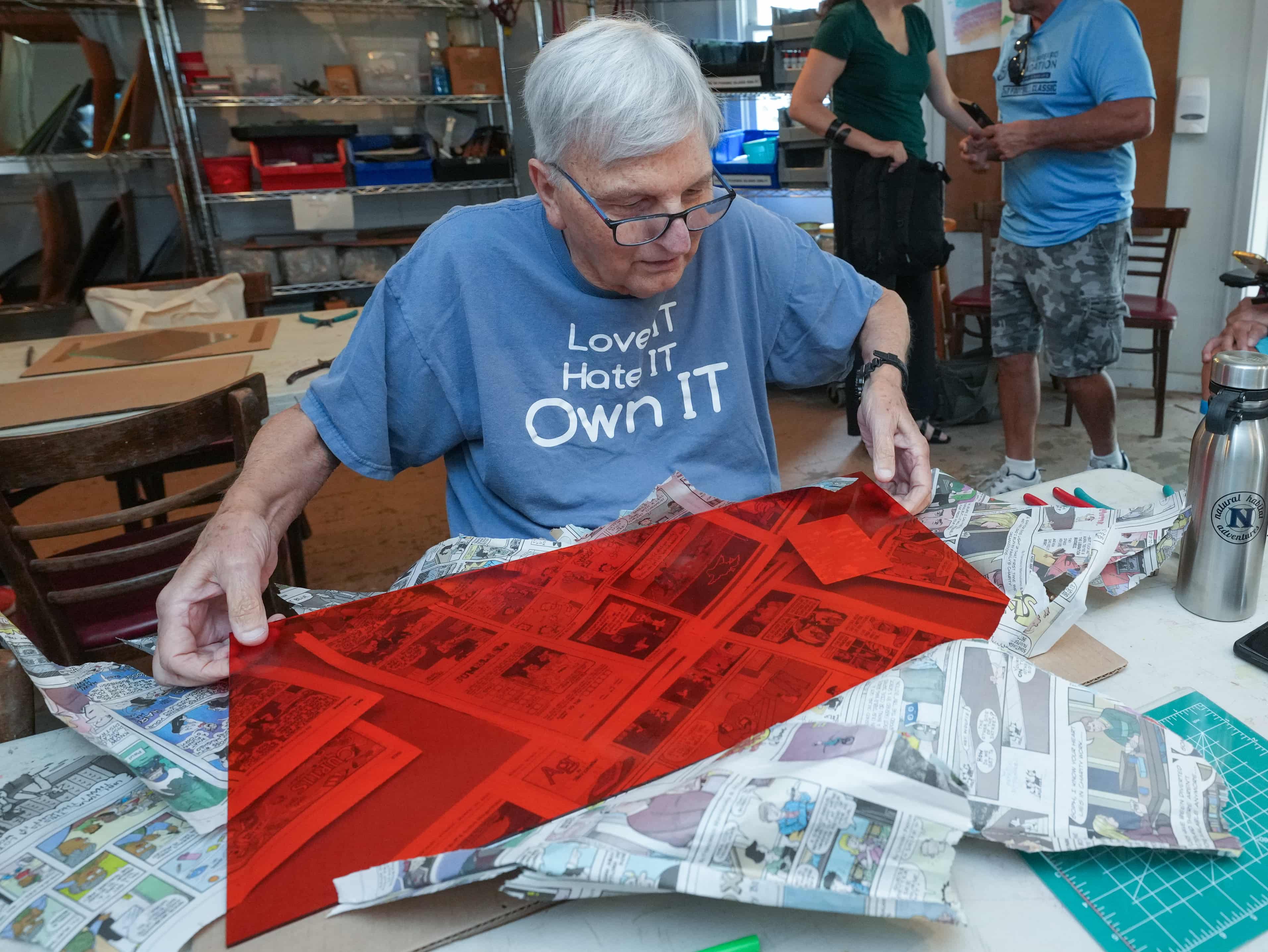 Adult making glass art