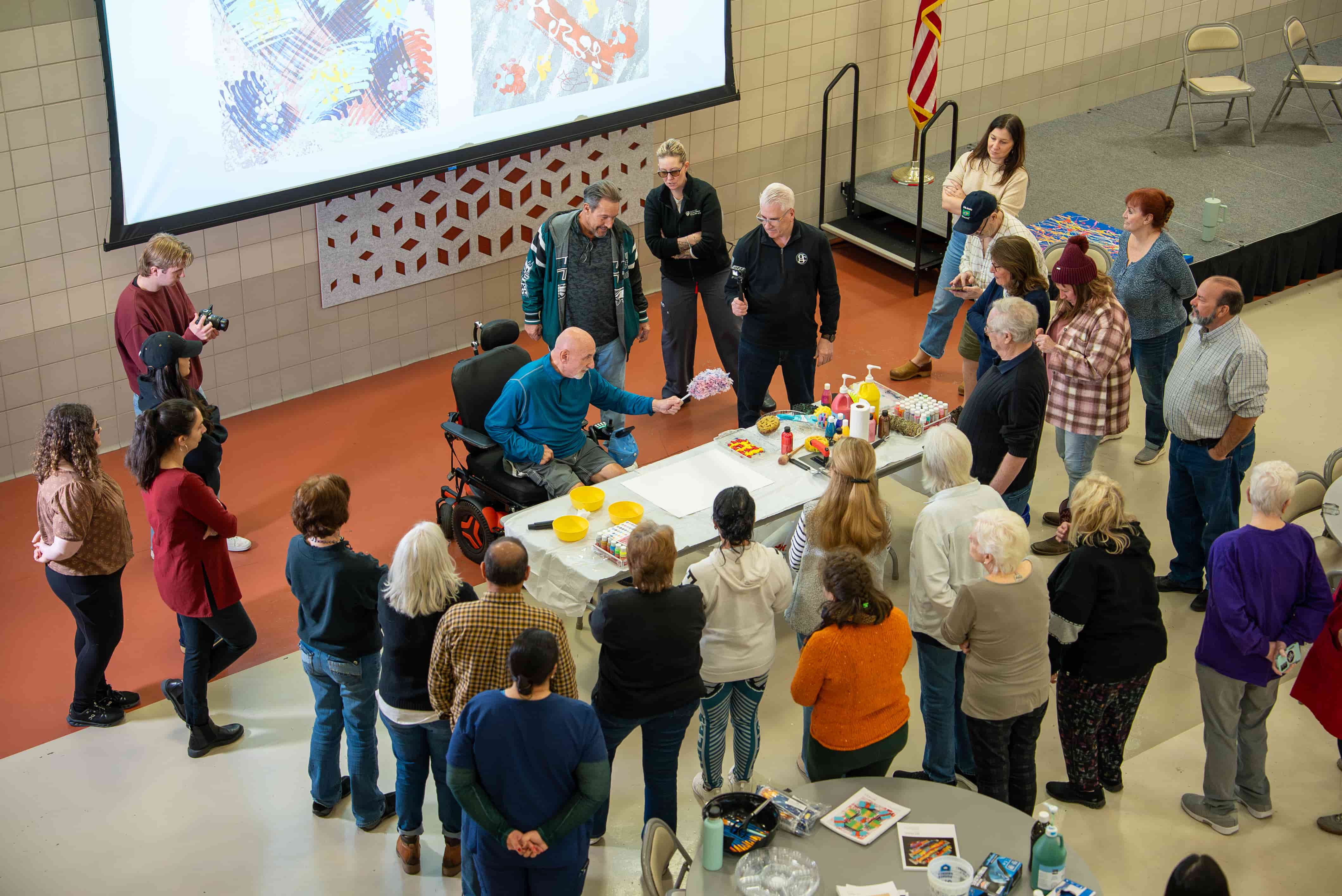 Dr.George & Group surrounding art supplies