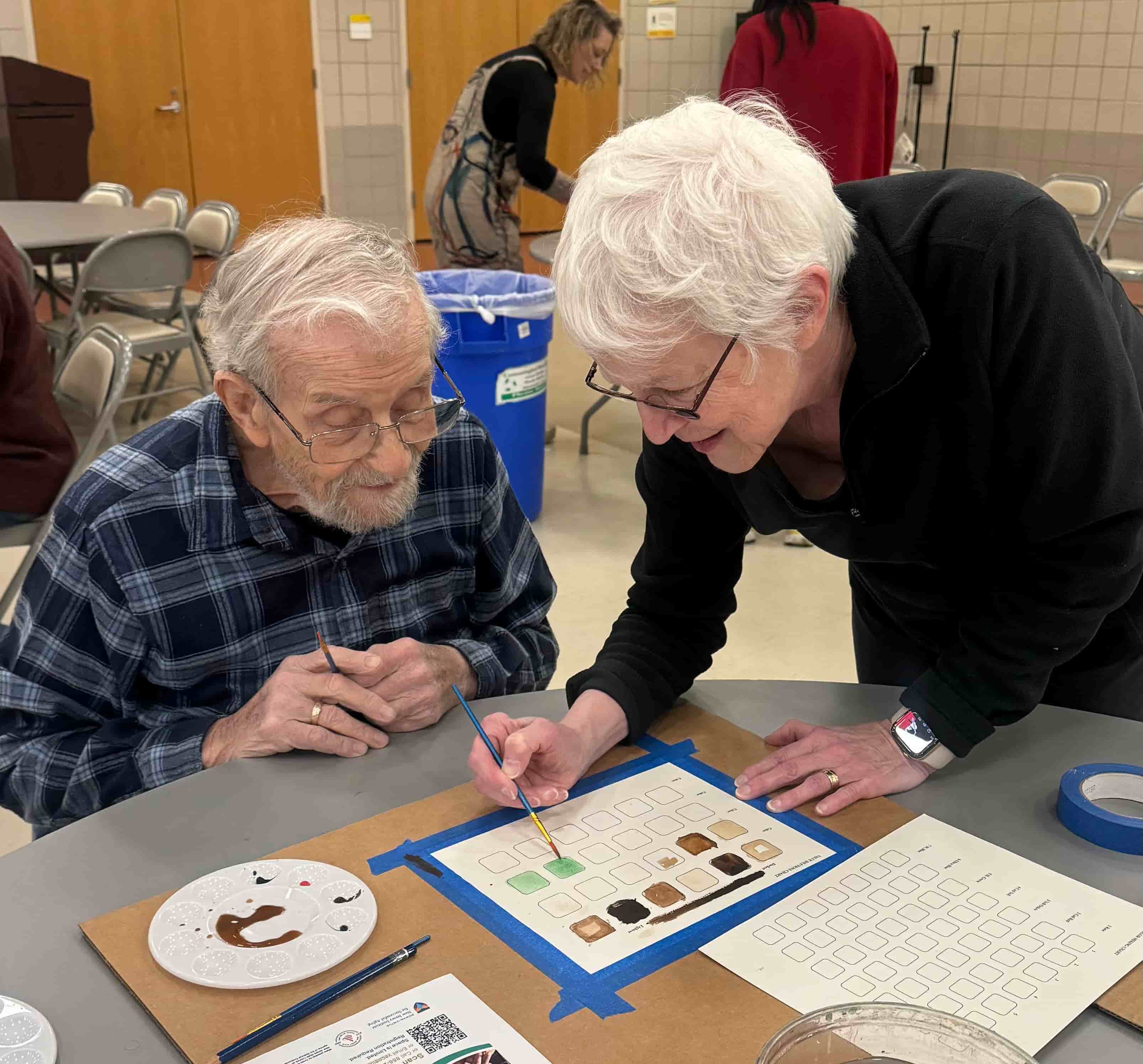 Adult making glass art
