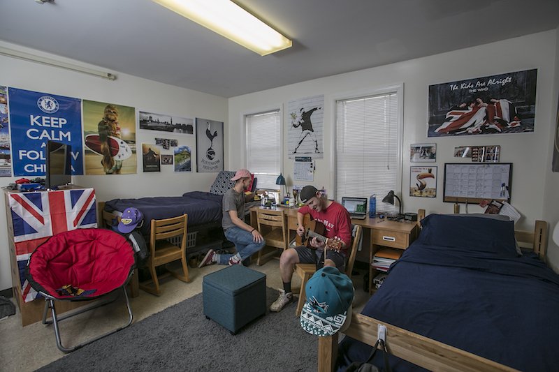 Two Rowan University students inside a double room in Mullica Hall