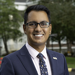 Dr. Stephen Fleming smiling in a suit