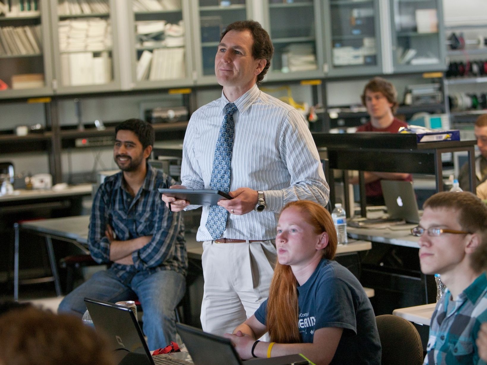 A professor giving a lecture inside a classroom