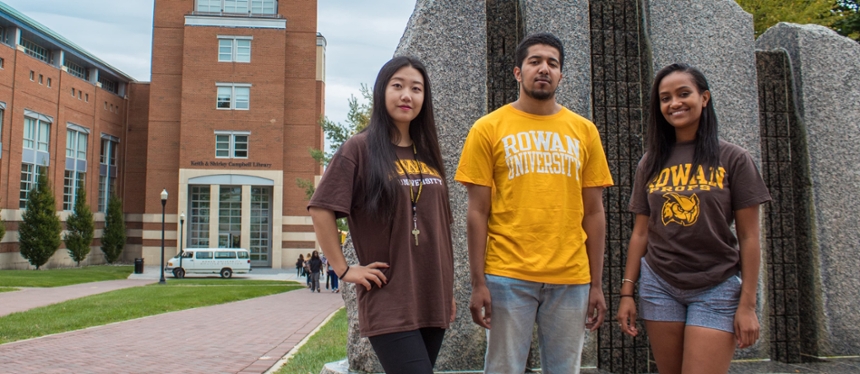 Students standing in front of the stone fountain outside of Campbell Library