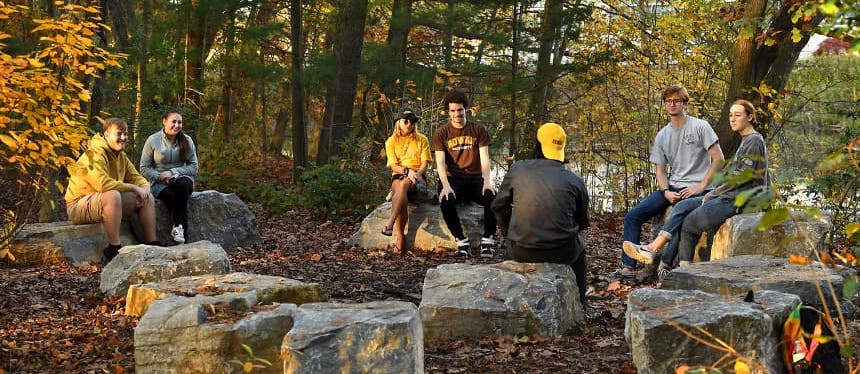 students sitting outside