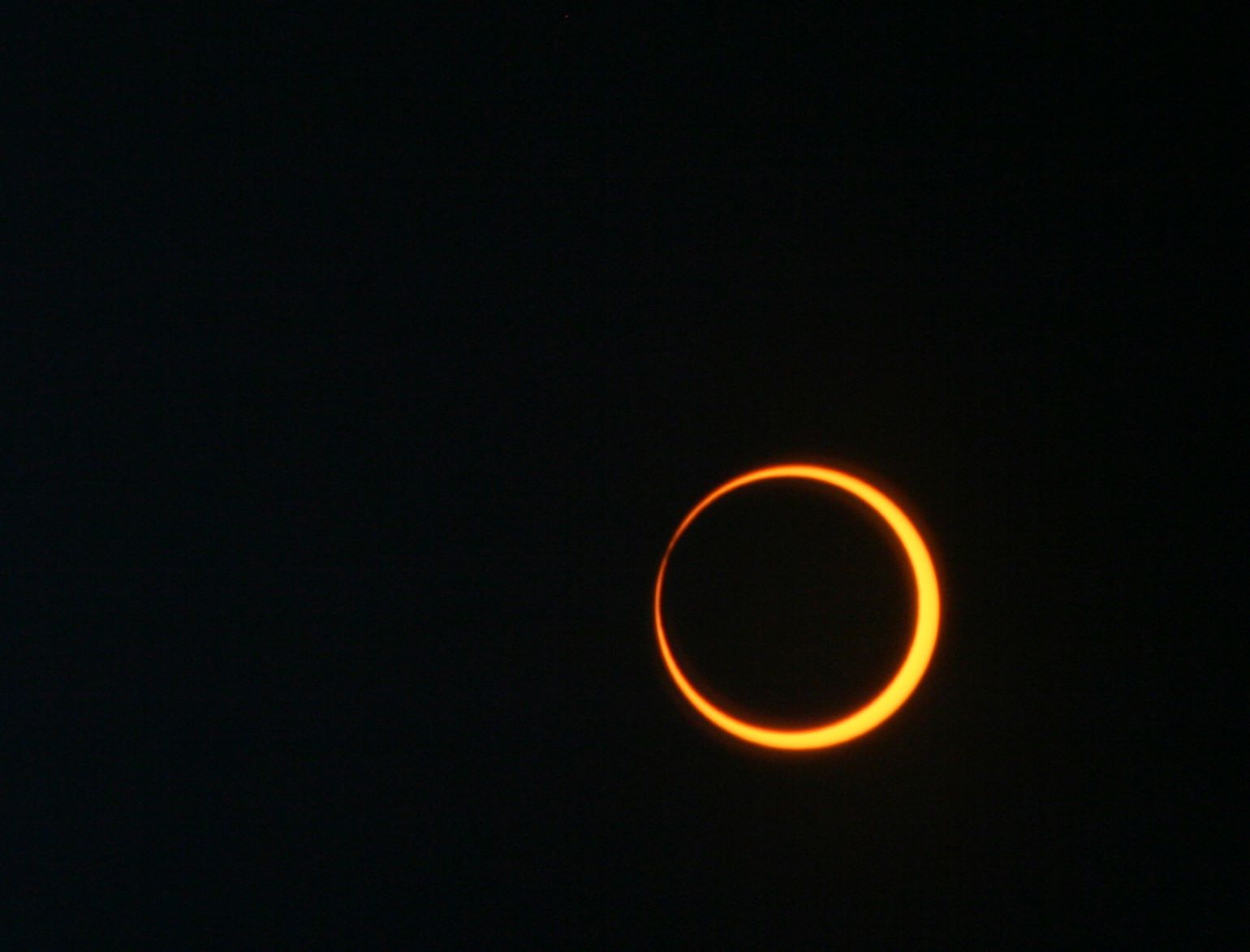 A ring of the sun is visible around a black background.  The rest of our star has been blocked out by the moon. This type of eclipse is called an annular eclipse.