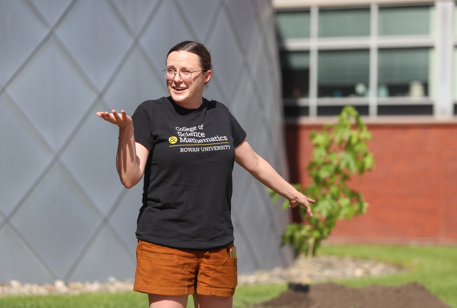 Dr. Sara Wright points to the Moon Tree during the planting ceremony