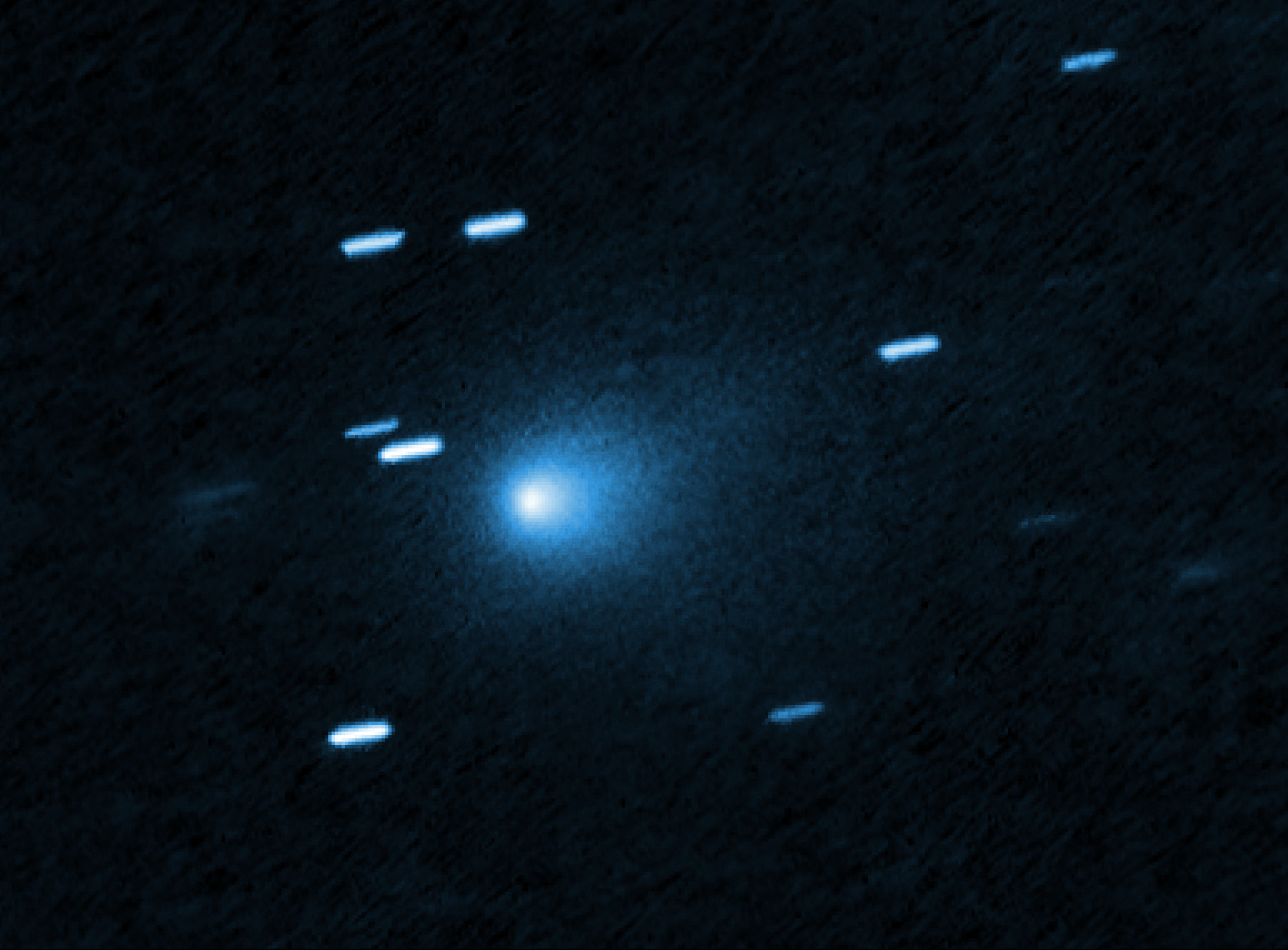 Comet 3I ATLAS appears as a blue smudge in this image from the Hubble Space Telescope