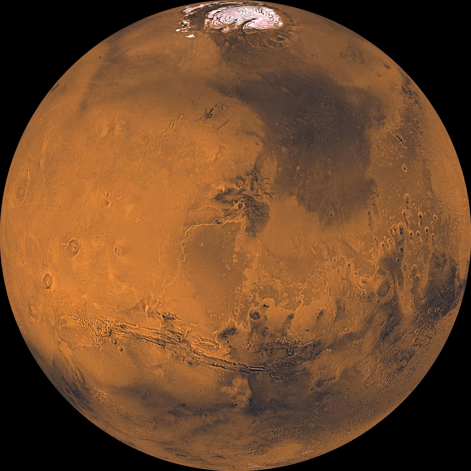 A detailed look at the planet Mars, as seen by NASA's Viking Orbiter.  Olympus Mons and three smaller volcanoes are visible alongside Mariner Valley and the northern ice cap.