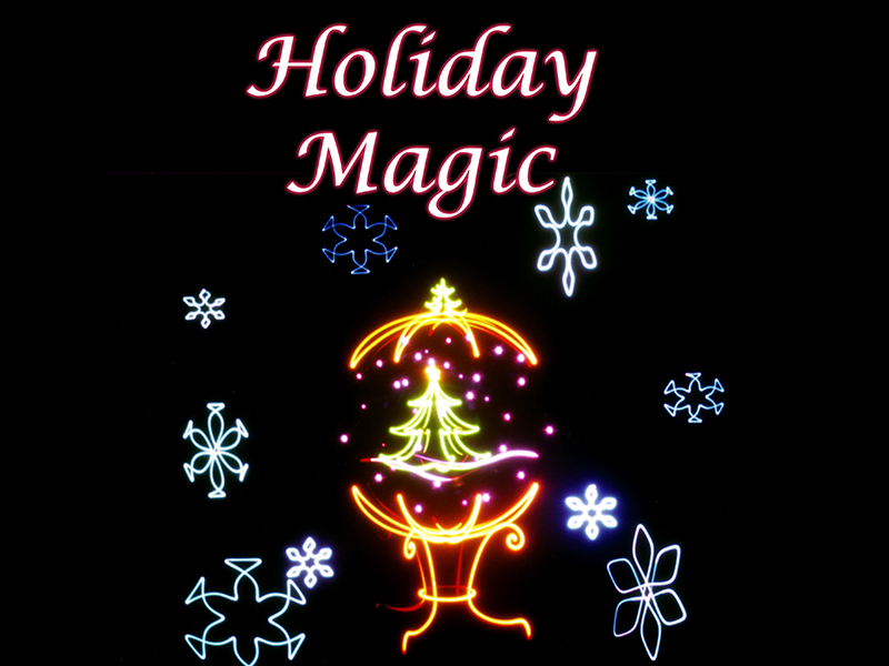 Snowflakes following around a snowglobe with a Christmas tree.. Text reads "Holiday Magic"