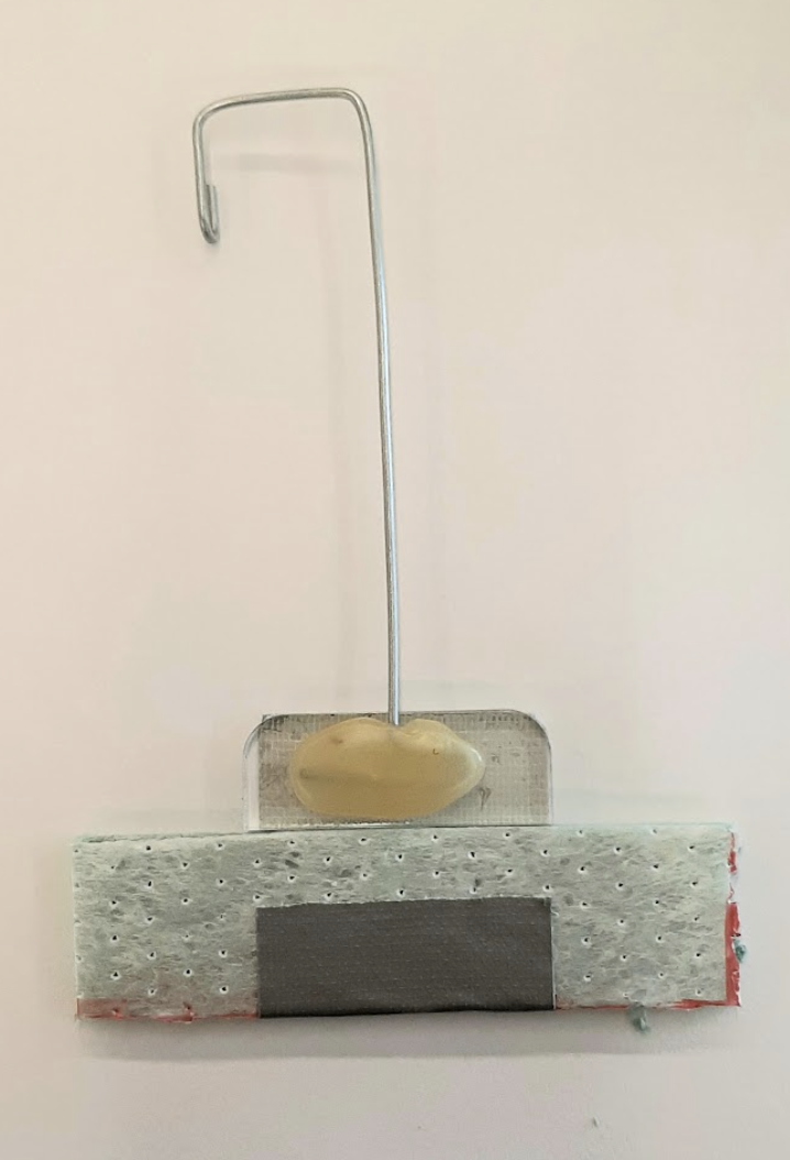 image of foam piece attached to wire paddle with ducttape