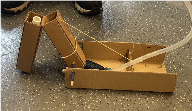 Image of the single leg iteration made out of cardboard