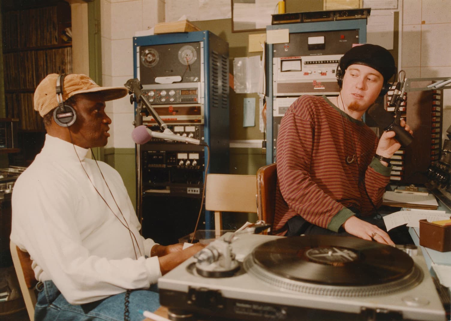 Two men sitting in a radio room