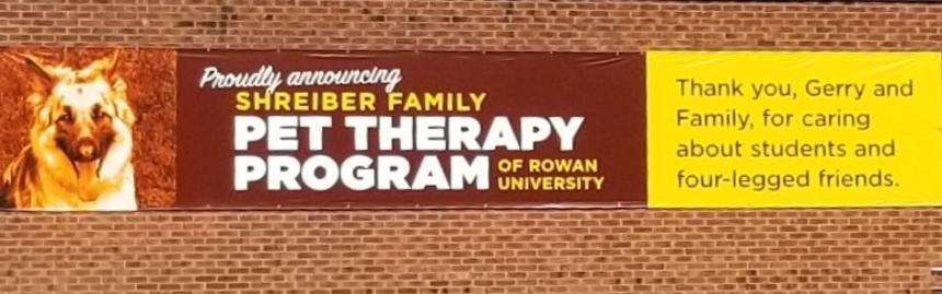 Shreiber Family Pet Therapy Banner on the Wellness Center Building 